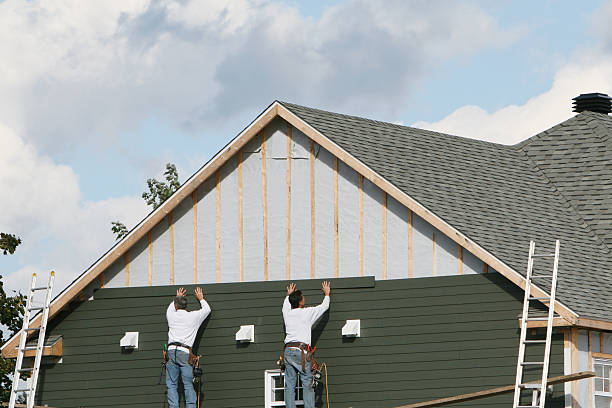 Professional Siding Contractor technician working in Camden, TN